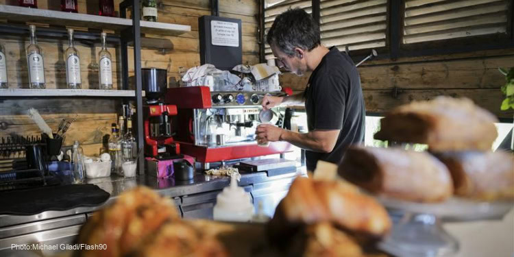 Man works in a cafe
