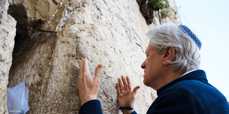 Bishop Lanier praying at Western Wall